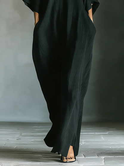 Alessandra • Vestido largo negro oversize minimalista con mangas de kimono